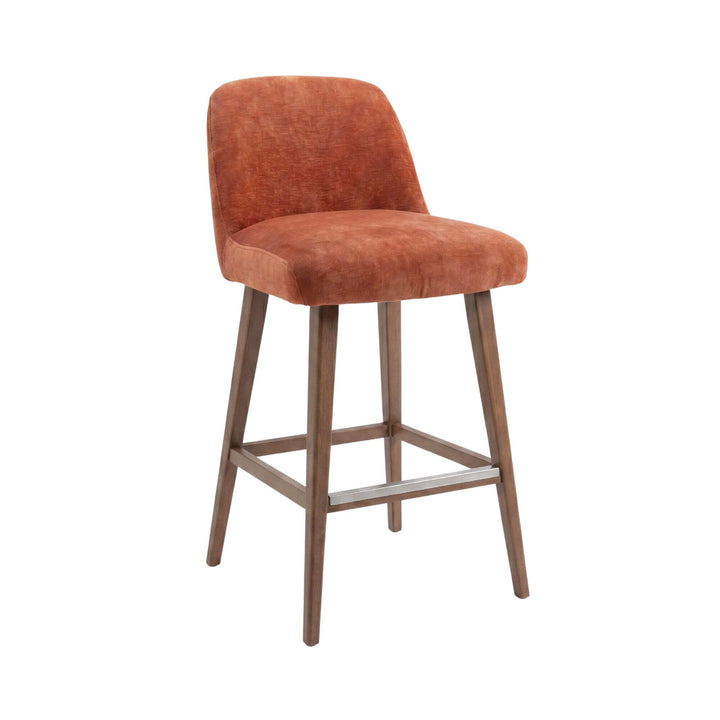 Front view of the Cord Gracia bar stool showing its upholstered rust seat, curved backrest, and beech wood legs.