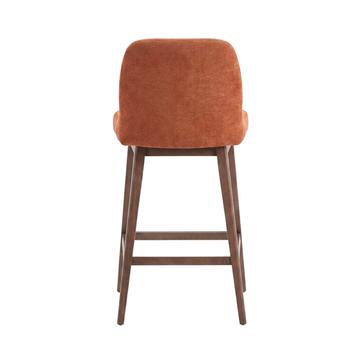 Rear view of the bar stool showing its softly curved backrest and slender wooden frame.