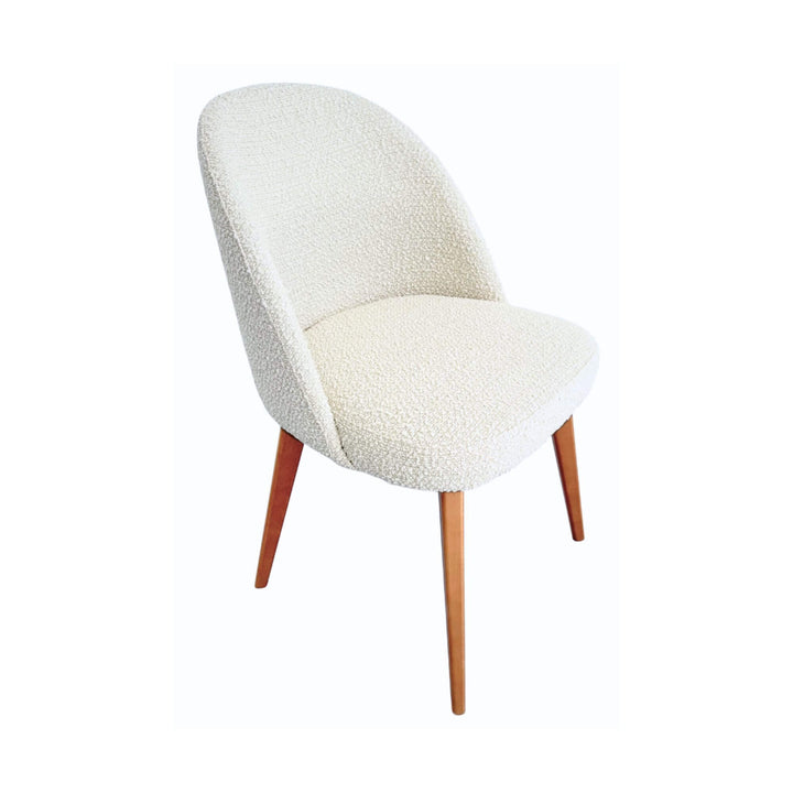 Angled view of Cord Gracia dining chair emphasizing compact design and comfort