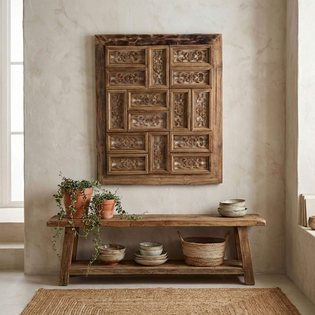 Decorative wooden Corteza wall panel above a wooden console table with decorative items in a room.