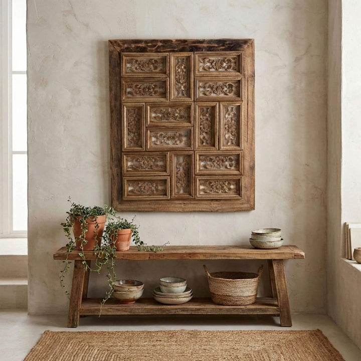 Decorative wooden Corteza wall panel above a wooden console table with decorative items in a room.