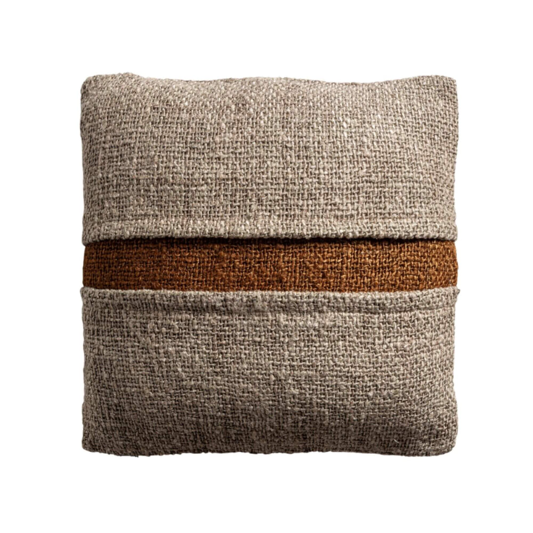 Front view of Corteza cushion with central brown accent band and textured surface