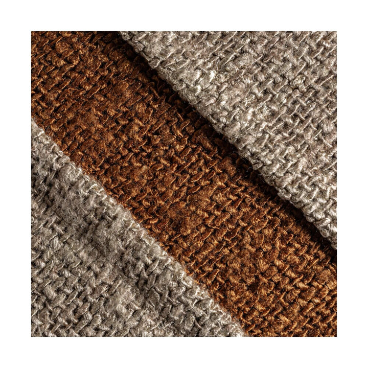 Close-up view of Corteza cushion showing textured viscose weave in natural and brown tones