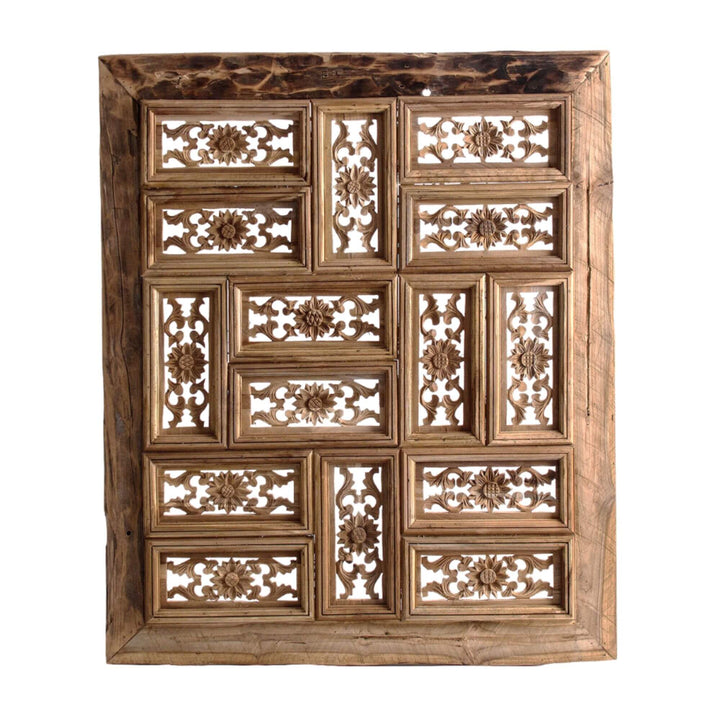 Hand-carved reclaimed wood wall panel with floral motifs.