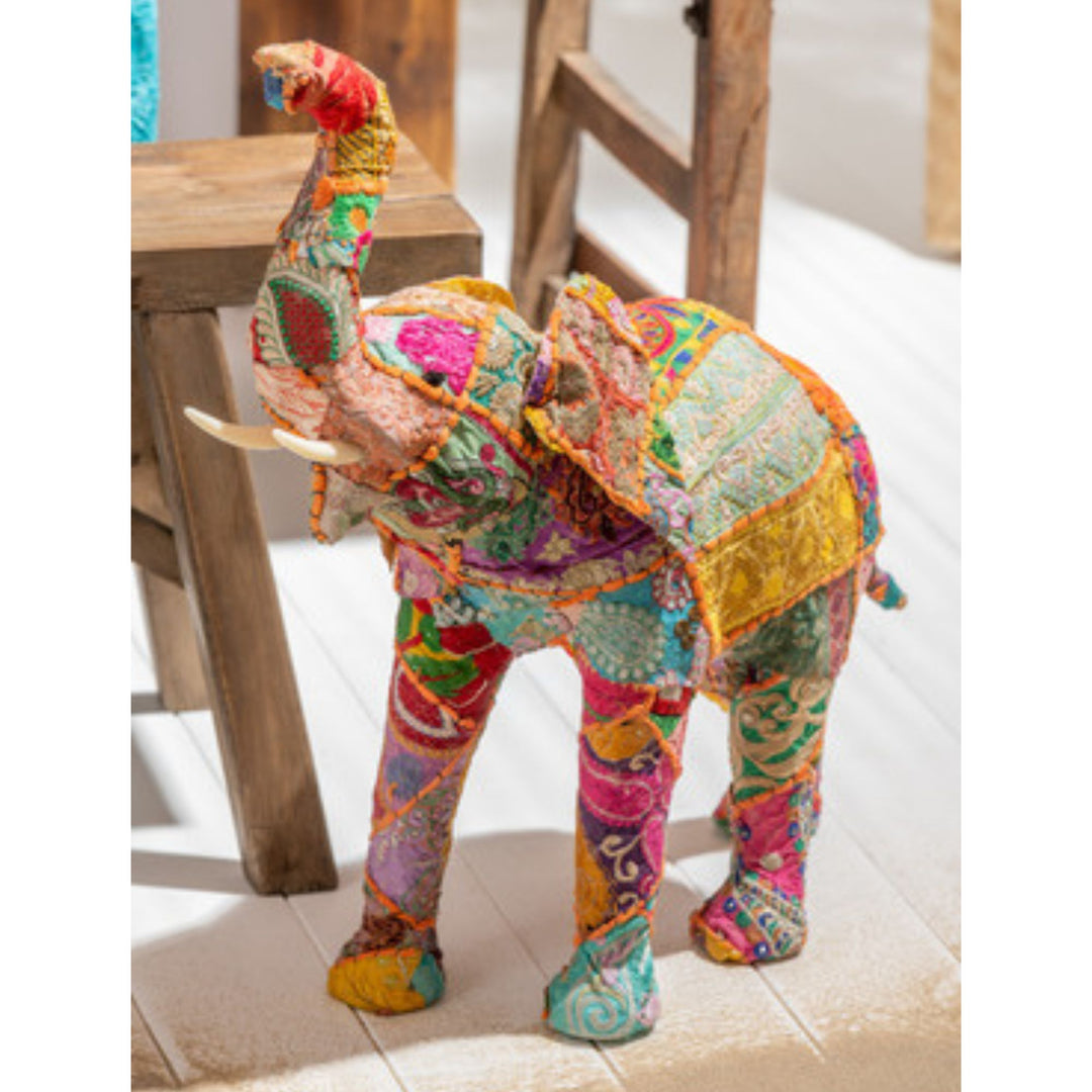 Styled interior view of Cotton Patches Elephant placed beside furniture, highlighting its vibrant handcrafted details.