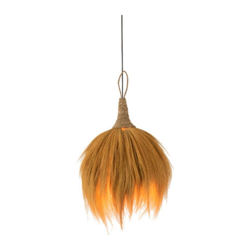 Coza Lamp’s layered seagrass fibers turn on.