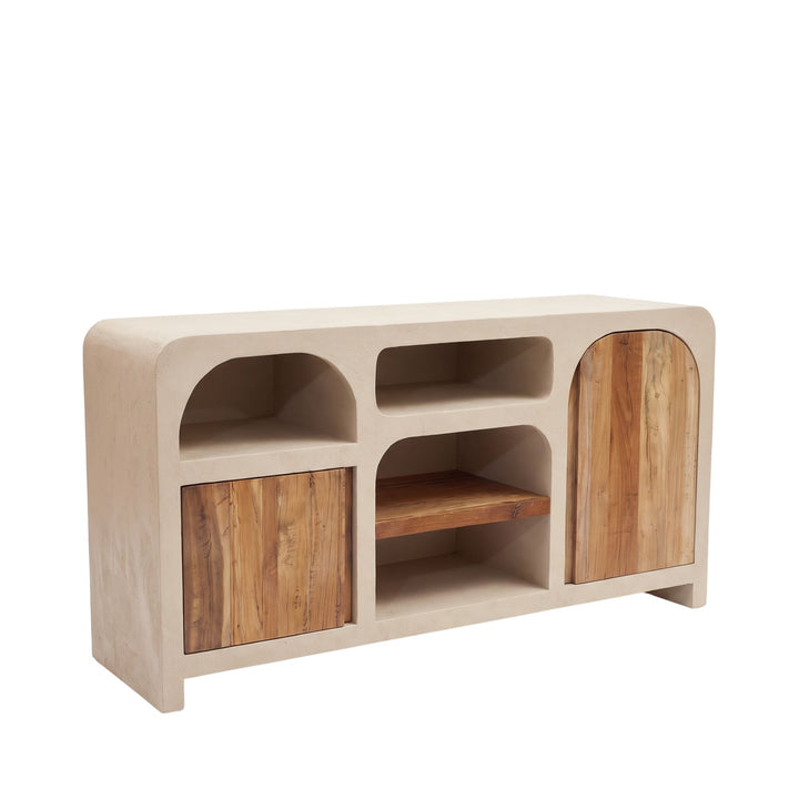 Front angled view of the Creta buffet with warm beige cement structure, arched compartments, and recycled wood doors