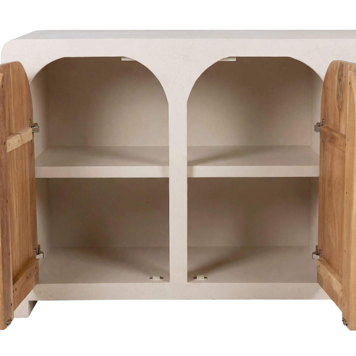 Open cabinet view showing the interior storage shelves behind the arched doors.