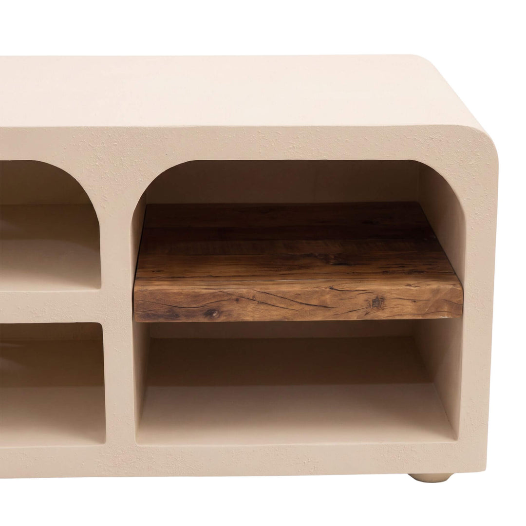 Close-up of the Creta TV console highlighting the arched shelving and contrasting recycled wood surface