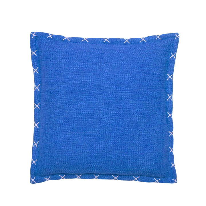 Front view of the Crosswave cushion showing its deep blue washed cotton fabric and stitched edge detail.
