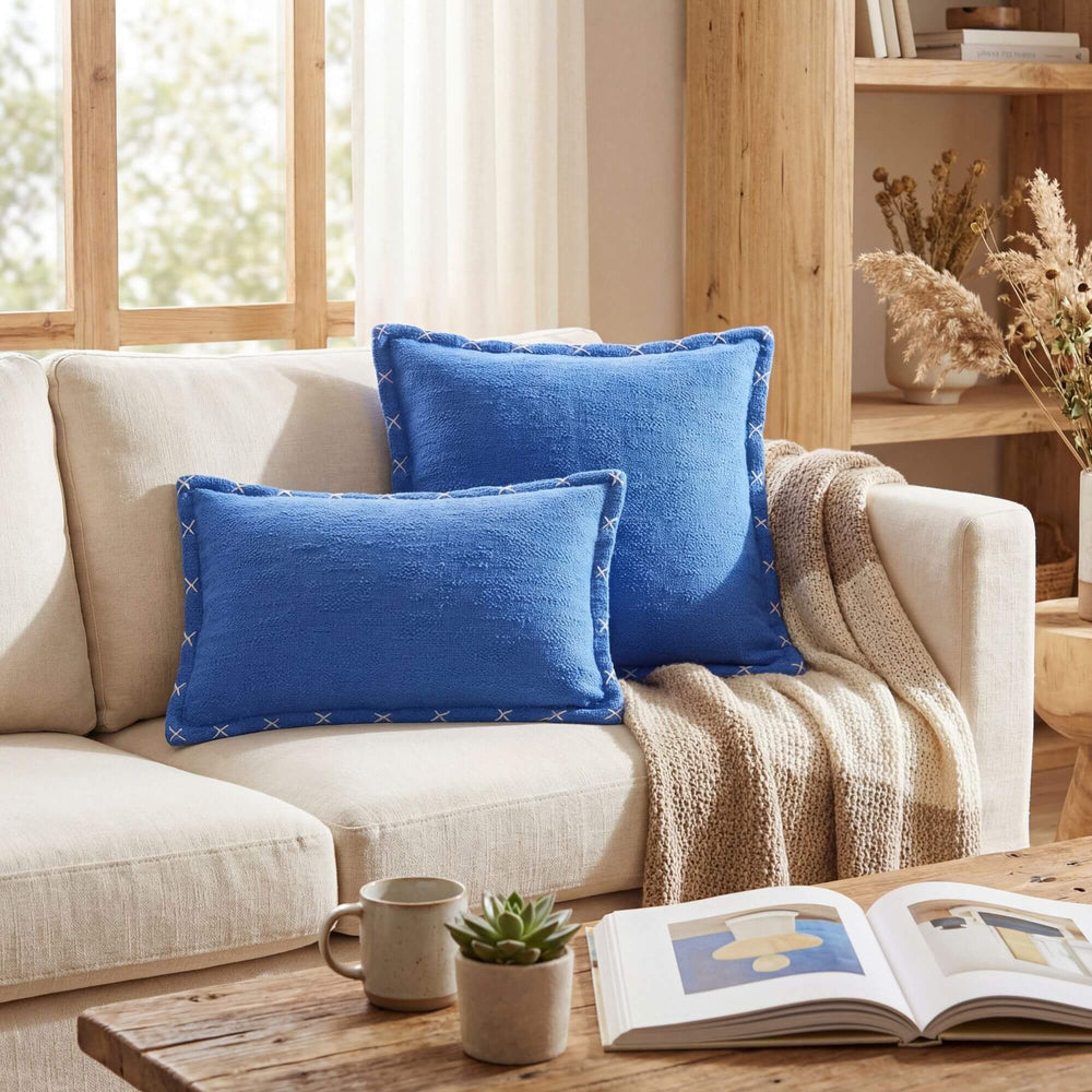 Styled interior setting featuring the Crosswave cushion on a sofa in a warm natural living space.