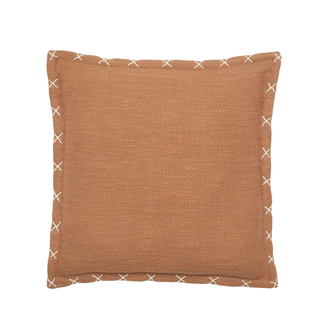 Front view of the Crosswave cushion showing its terracotta washed cotton fabric and contrast stitched edge detail.
