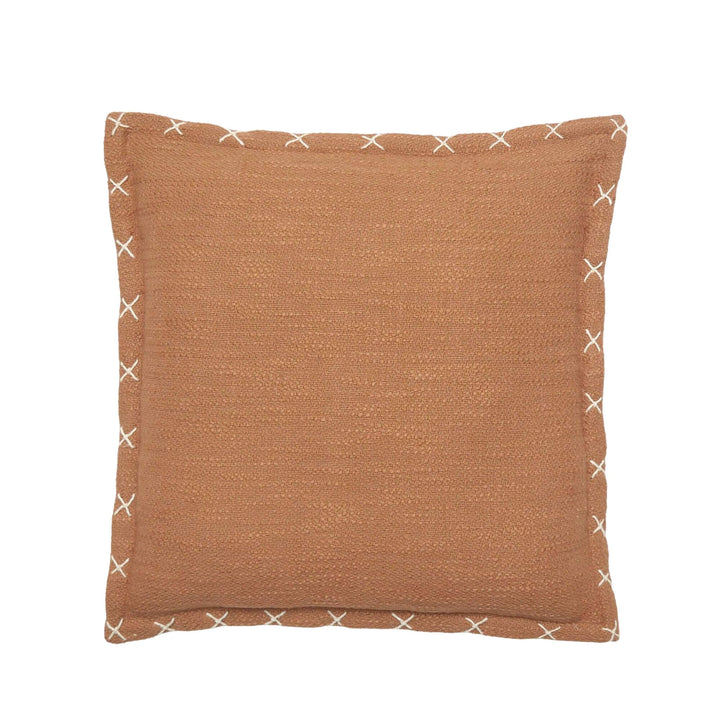 Front view of the Crosswave cushion showing its terracotta washed cotton fabric and contrast stitched edge detail.