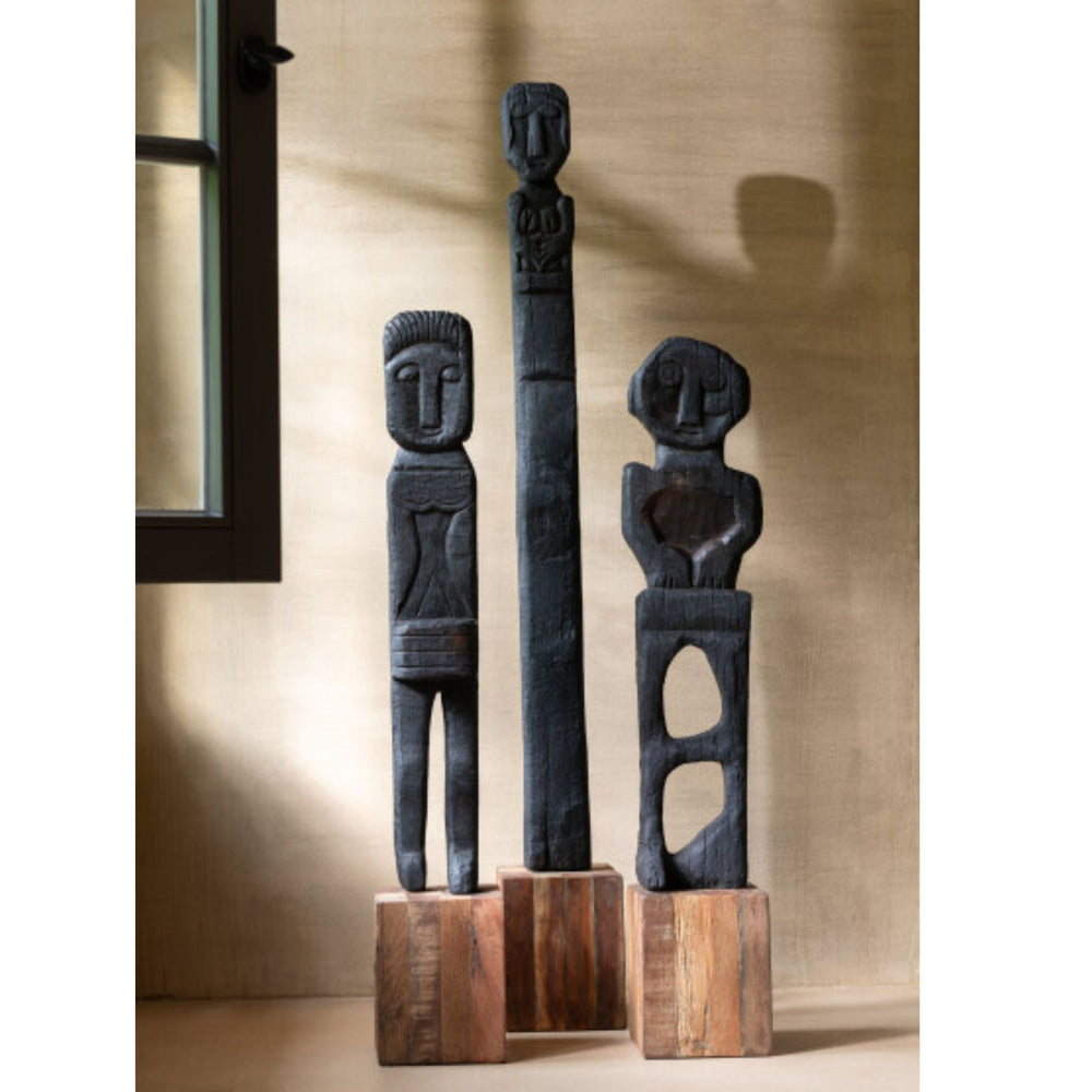 Interior styling image showing multiple Crozet Stand Deco sculptures displayed on wooden bases.