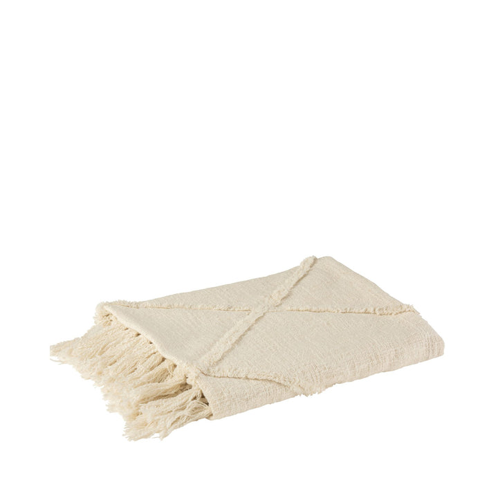 Folded Cuad plaid in ivory showing texture and fringed edges