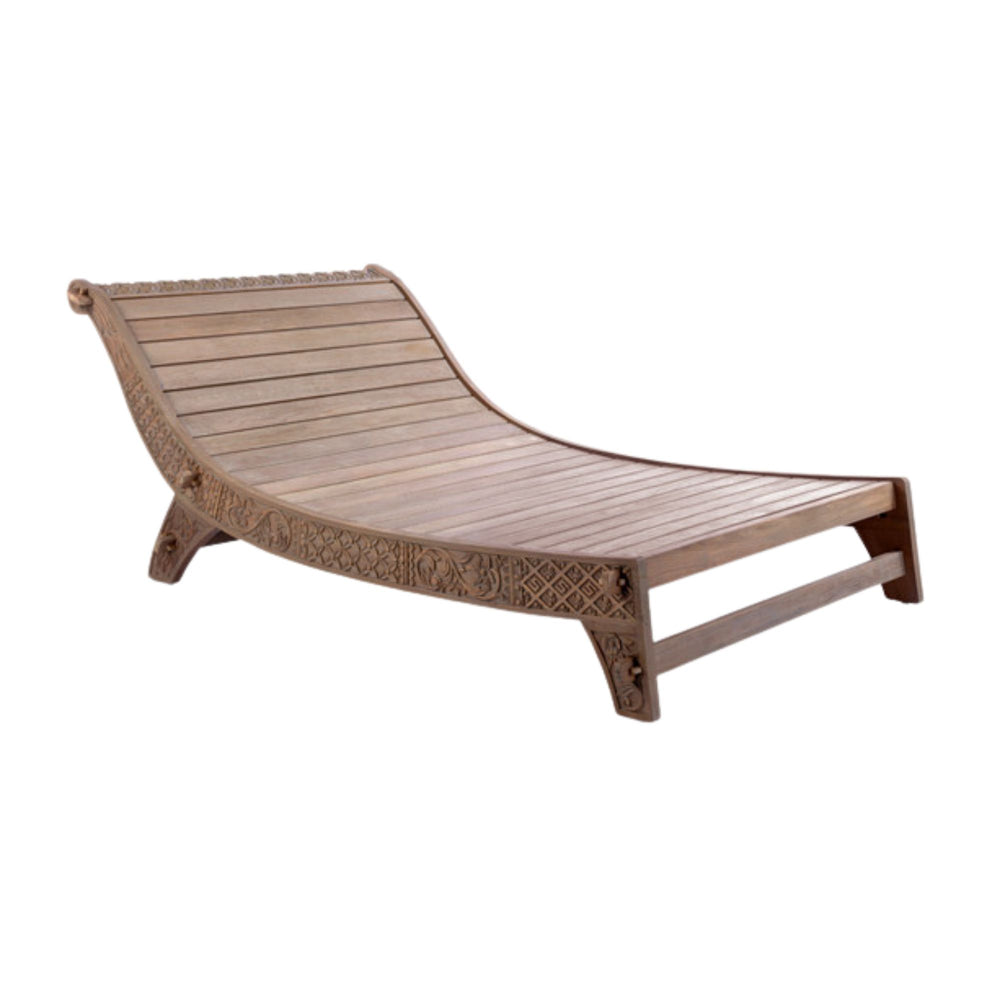 Side view of the Cyprus teak daybed highlighting its sculpted frame and relaxed profile.