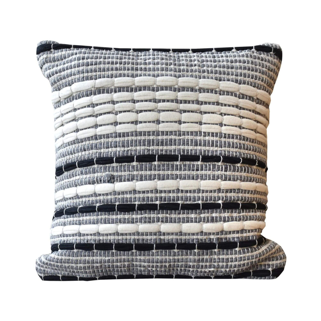 Front view of Darsha cushion with textured woven pattern in ivory, grey, and black