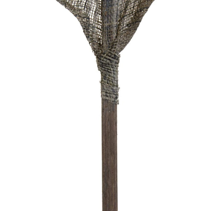 Detail of natural fiber stem on decorative green leaf