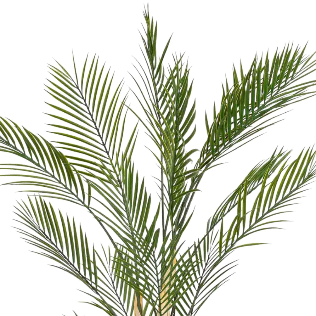 Detail view of palm fronds showing realistic synthetic foliage structure.
