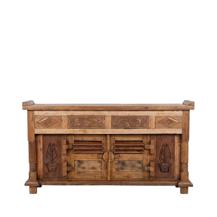 Front view of the buffet highlighting its carved drawer details and paneled doors.