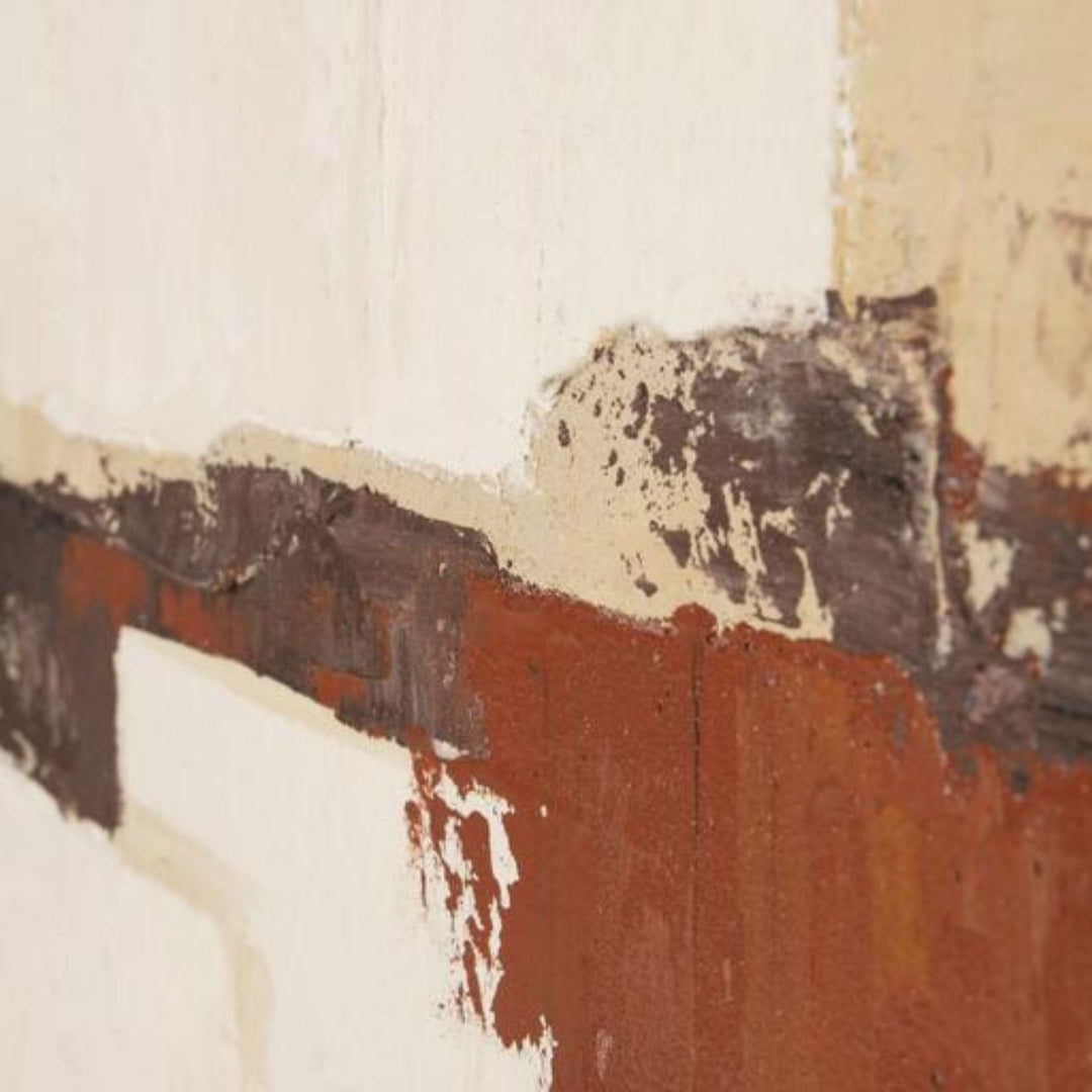 Close-up of the painting surface showing earthy tones and layered abstract texture.