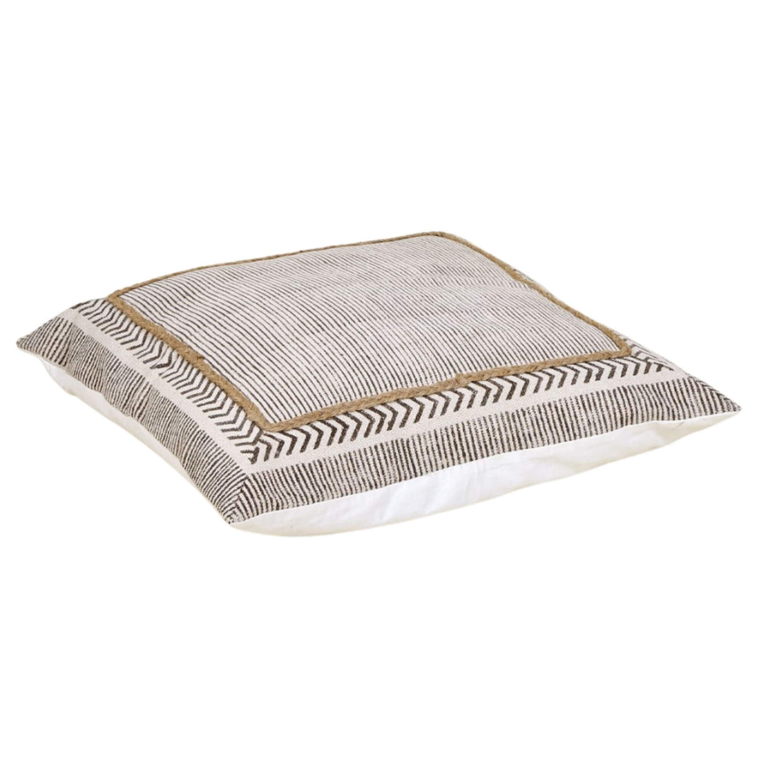 Dhara cotton floor cushion showing striped top panel and jute-trim border