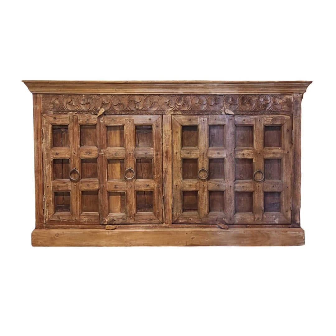 Dharnar Buffet made of carved sheesham wood with paneled doors.