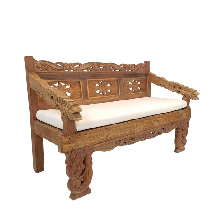 Angled view of the Diana daybed highlighting the carved legs and armrests.