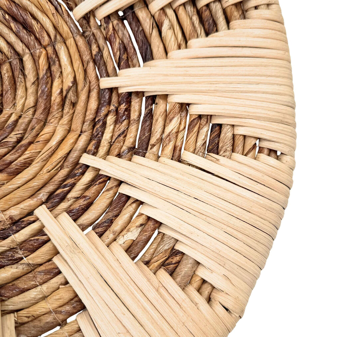 Close-up of woven banana and rattan details on Diani wall plate