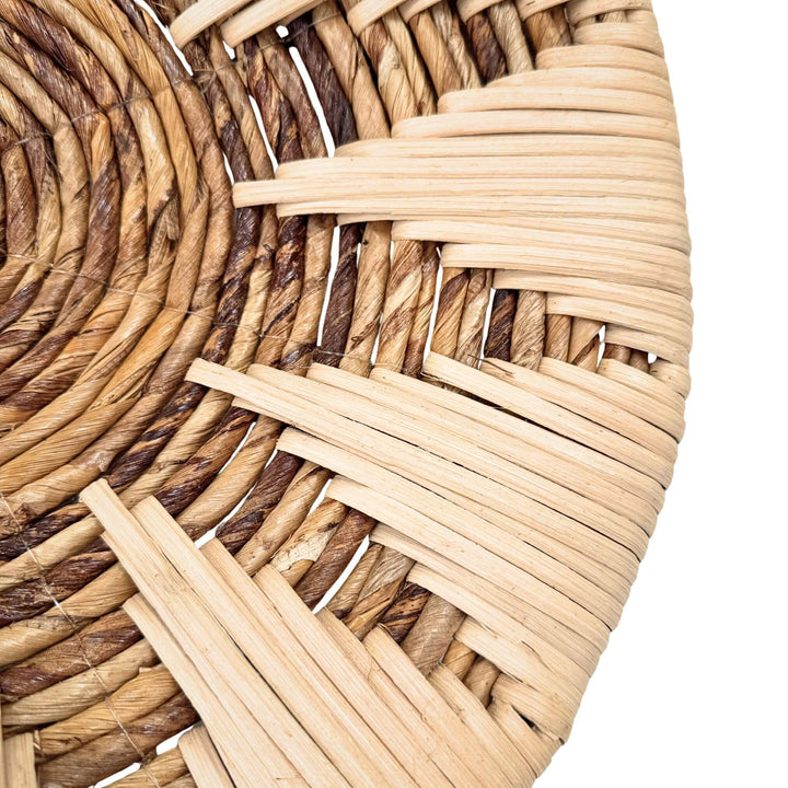 Close-up of woven banana and rattan details on Diani wall plate