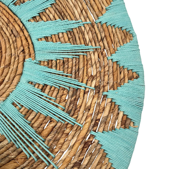 Side detail of Diani Wall Deco Plate showing texture and depth in turquoise and natural fibers