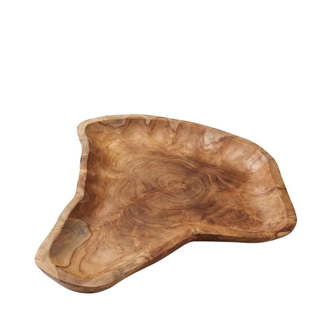 Front view of the Digul teak wood plate showing its organic carved shape.