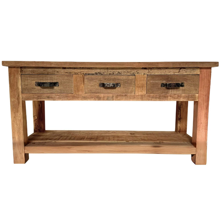 Wooden console table with three drawers on a white background