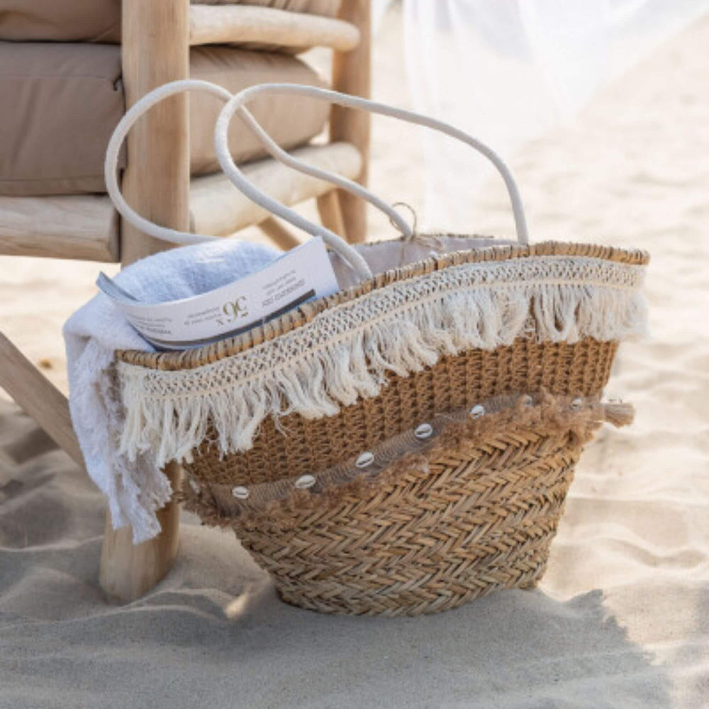 Dogon Jute Basket placed in a coastal interior setting with woven texture and white details.

