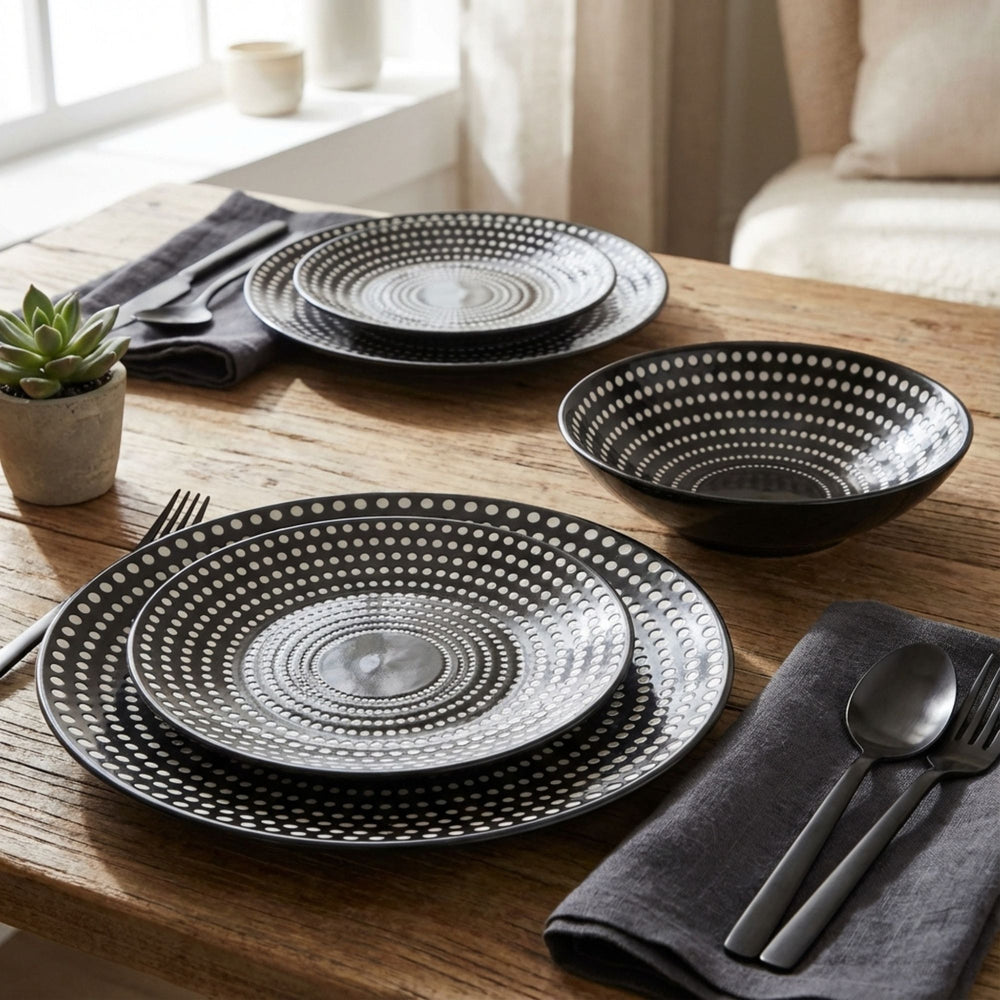 Dots tableware plates and bowls styled on a modern dining table.