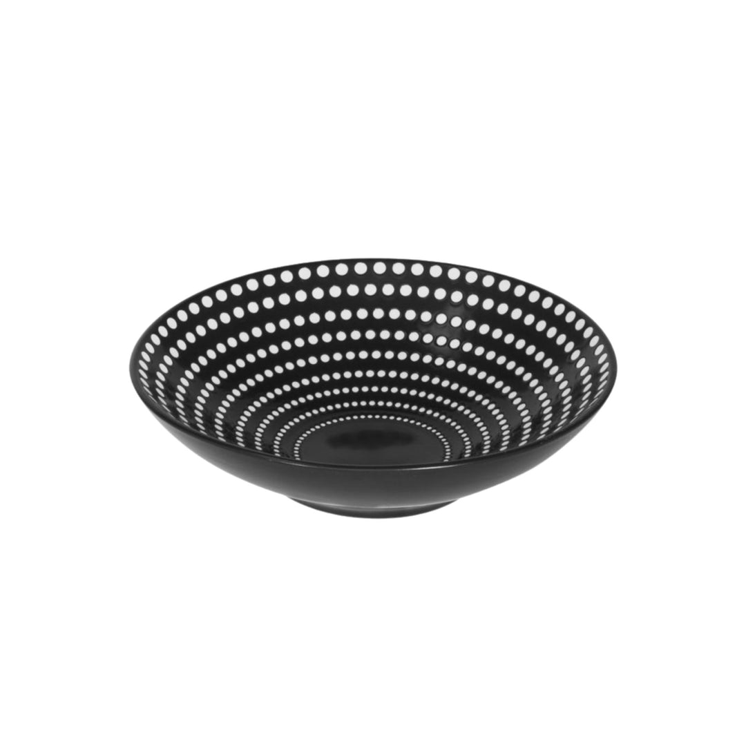 Side view of ceramic bowl highlighting depth and graphic dotted detailing.