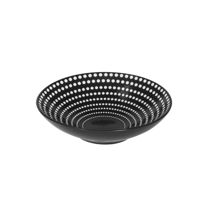 Side view of ceramic bowl highlighting depth and graphic dotted detailing.