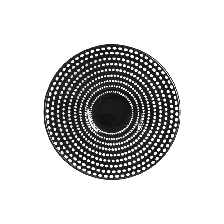 Top view of ceramic bowl highlighting depth and graphic dotted detailing.