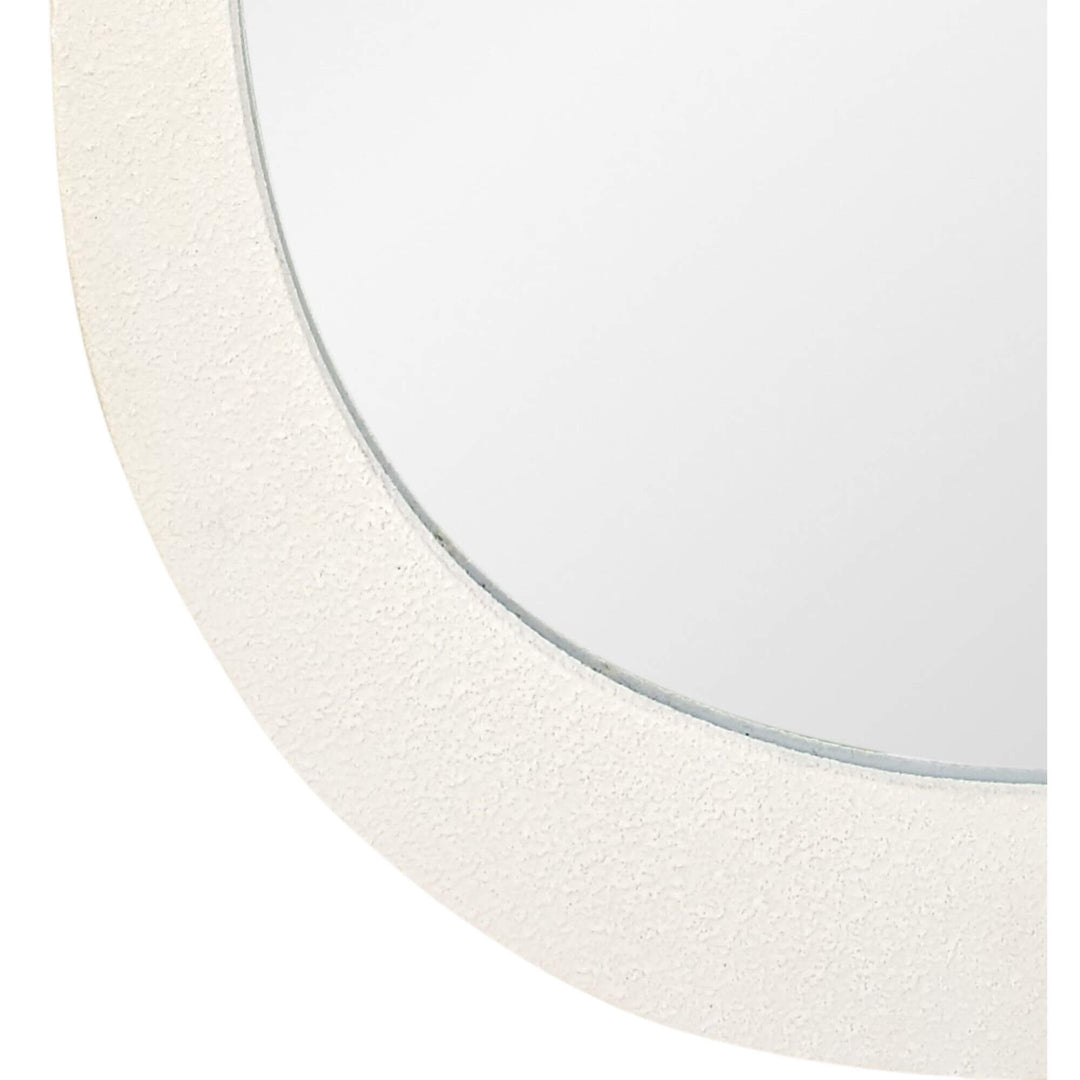 Beige metal frame detail of drop mirror