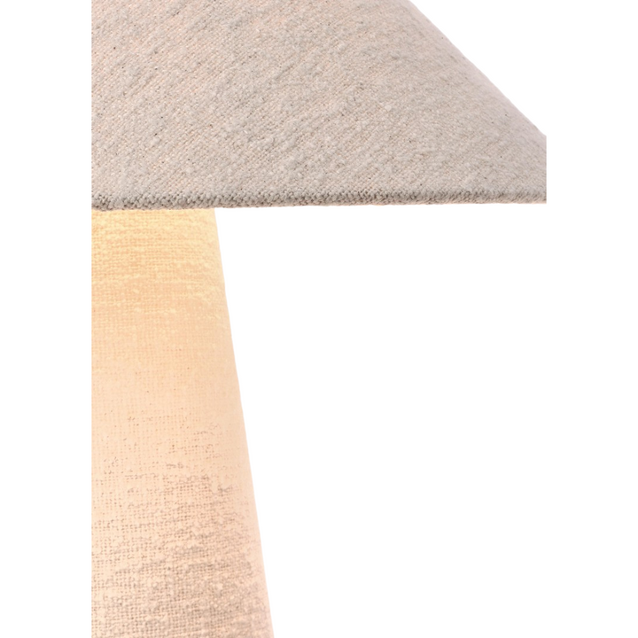 Close-up of Lit boucle fabric texture and lamp shade edge of the Duna lamp.