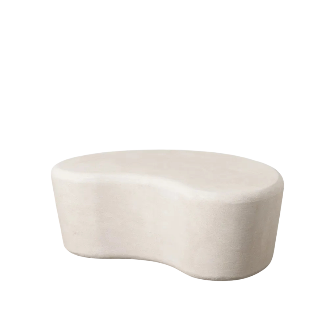 Side view of Dune Organic Coffee Table highlighting its curved profile and textured finish.