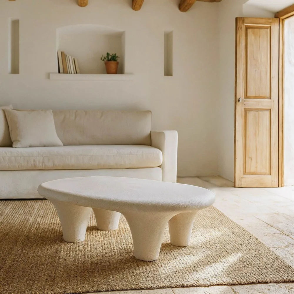 Interior setting featuring the Dune Coffee Table styled in a minimalist living room.