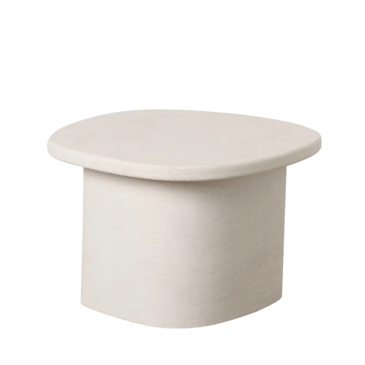 Front view of the Dune coffee table showcasing its rounded silhouette and textured painted surface.
