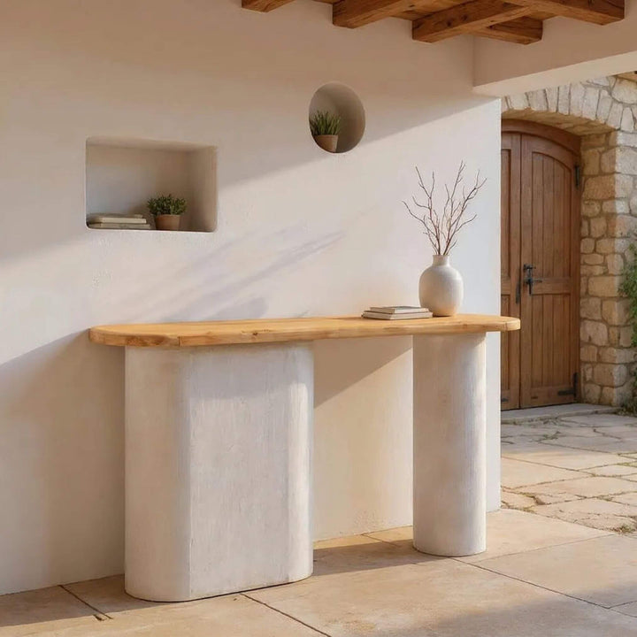 Console table styled in an entryway with decorative accents.