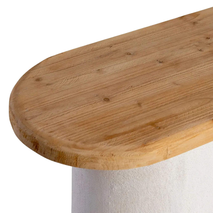 Angled view highlighting contrast between warm wood and white base.