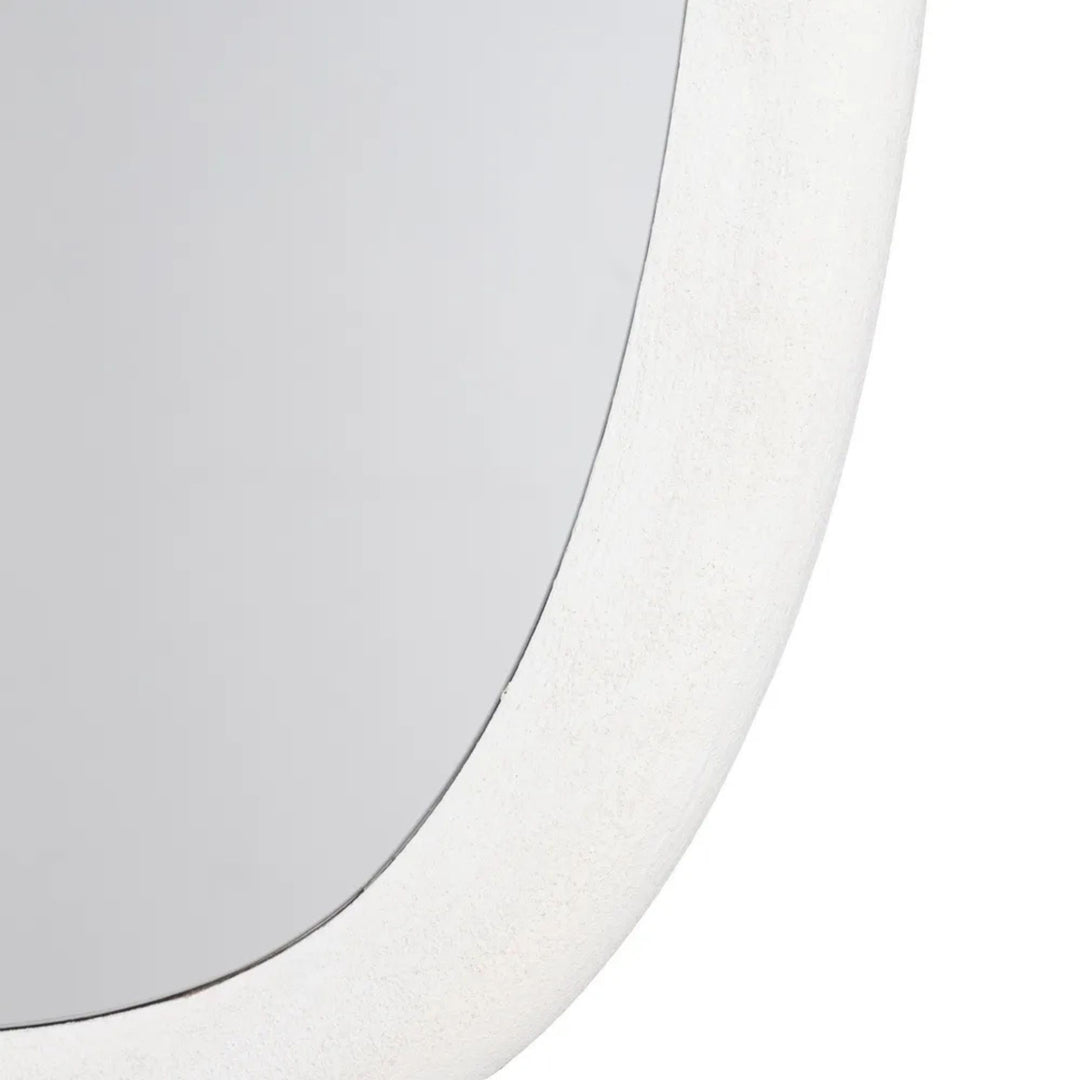 Close-up detail of the Dune mirror frame highlighting the textured painted finish.