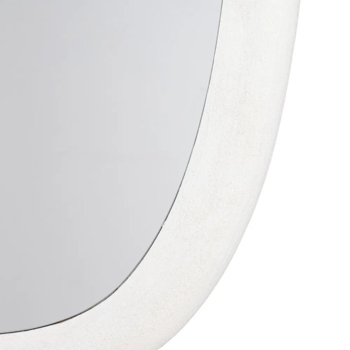 Close-up detail of the Dune mirror frame highlighting the textured painted finish.