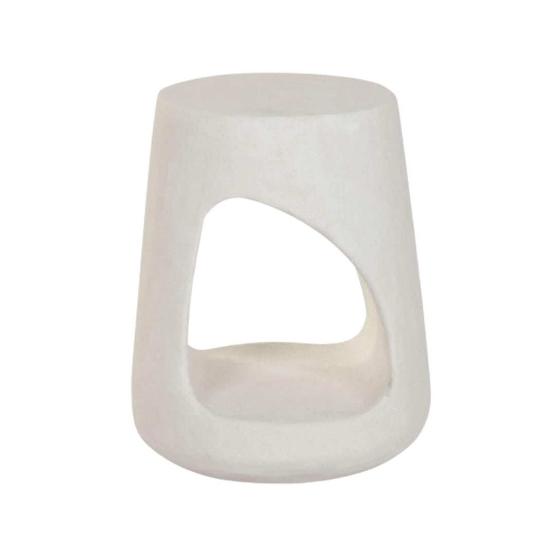Front view of the Dune Stool featuring its sculptural opening and matte white finish.