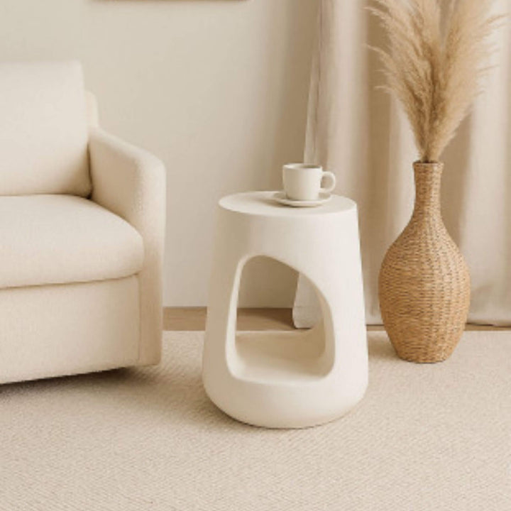 Dune Stool styled as a side table in a neutral modern living room.