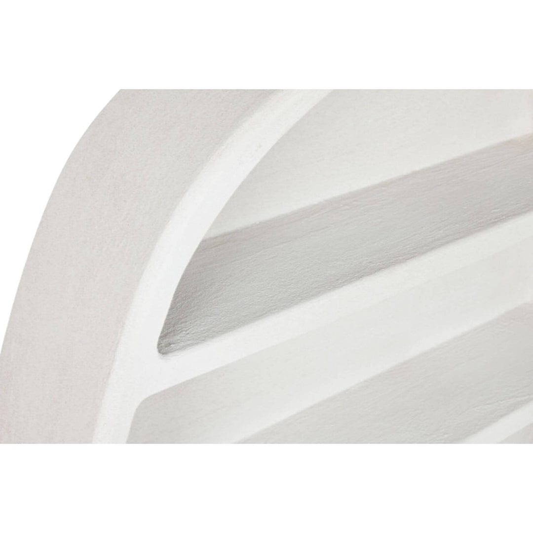 Close-up of shelf edge with textured white paint finish